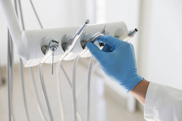 Professional Tooth Extraction technician working in Quincy, MA